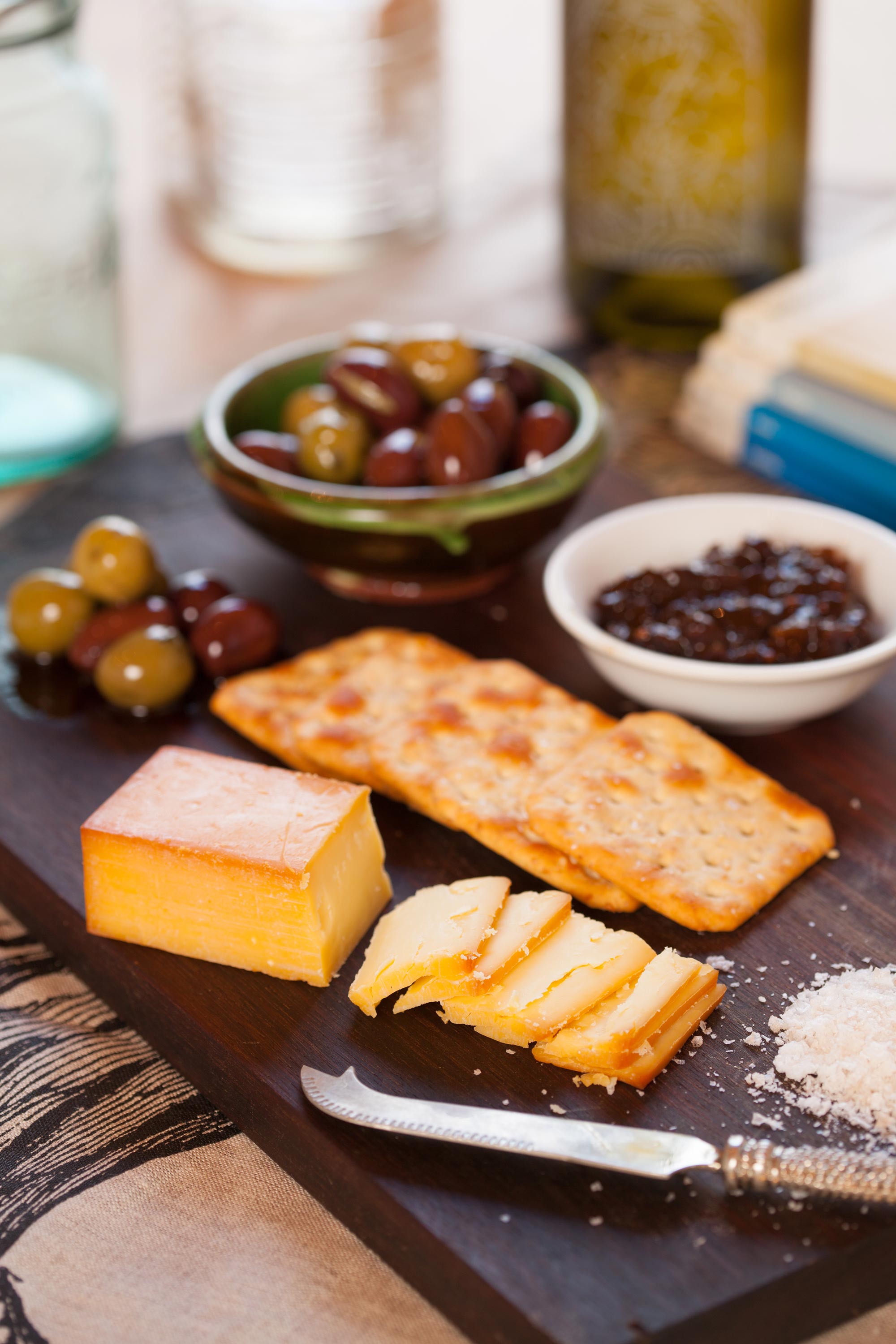 Cheese and salt on a platter with condiments